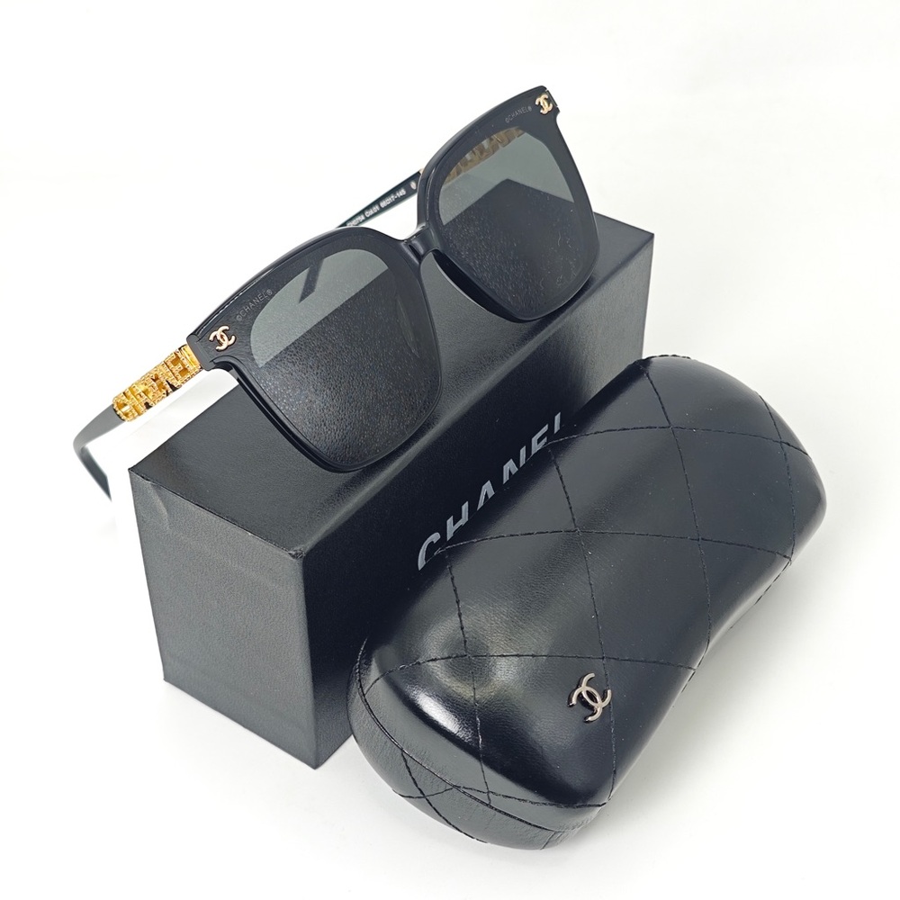 CHANEL Elegant Black Sunglasses with Gold Details